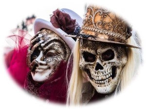 Image of 2 carnival goes wearing skeleton masks and hats. The image has soft edges and no border.